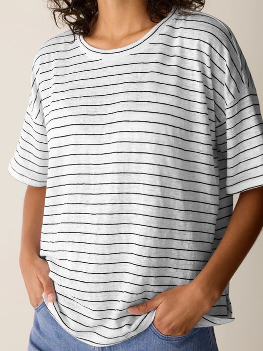 White striped short sleeve box top with relaxed fit on model