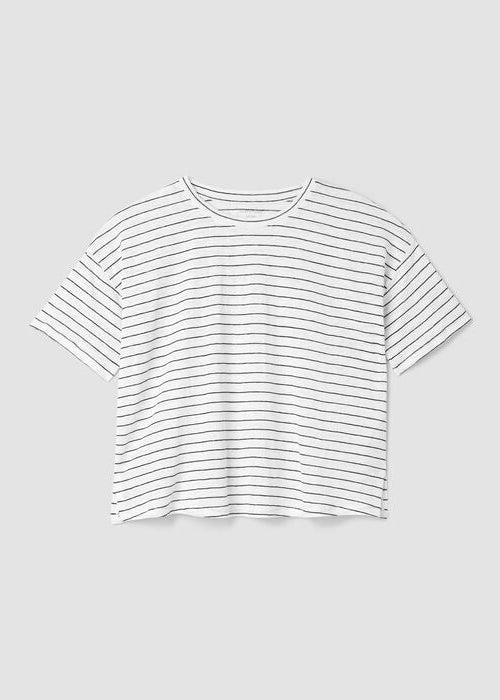 White short sleeve boxy t-shirt with black horizontal stripes, flat lay view