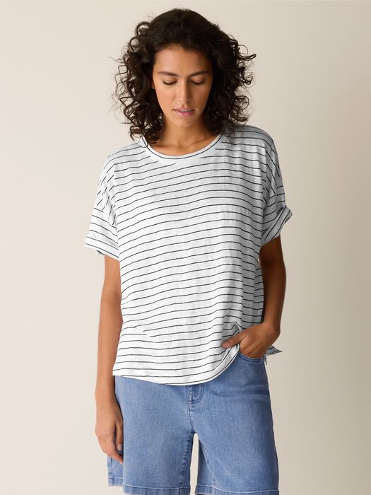 White striped short sleeve crew neck top with relaxed fit on model