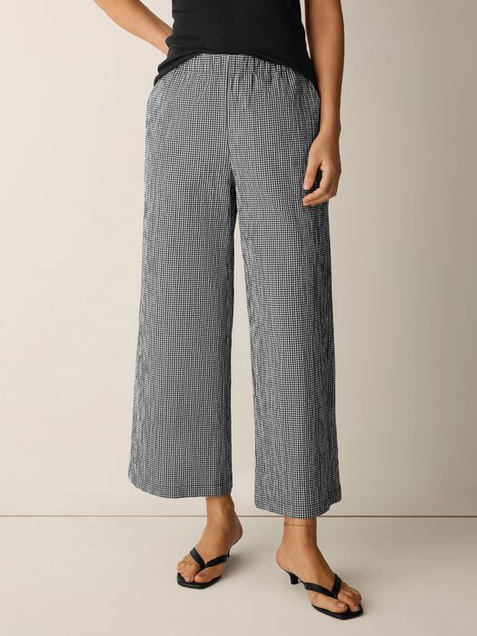 Wide leg ankle pants in black and white gingham check pattern on model