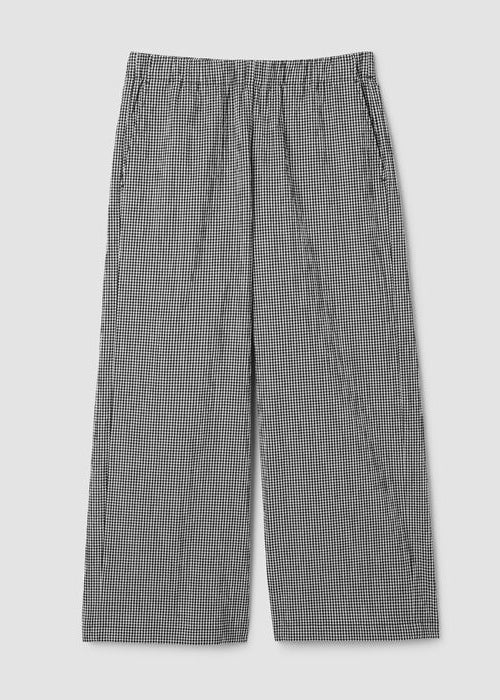 Wide leg ankle pants in black and white check pattern, flat lay view