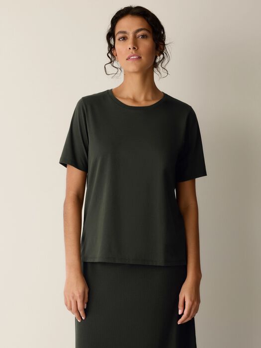 Dark green-black short-sleeve crewneck tee on model, relaxed drape
