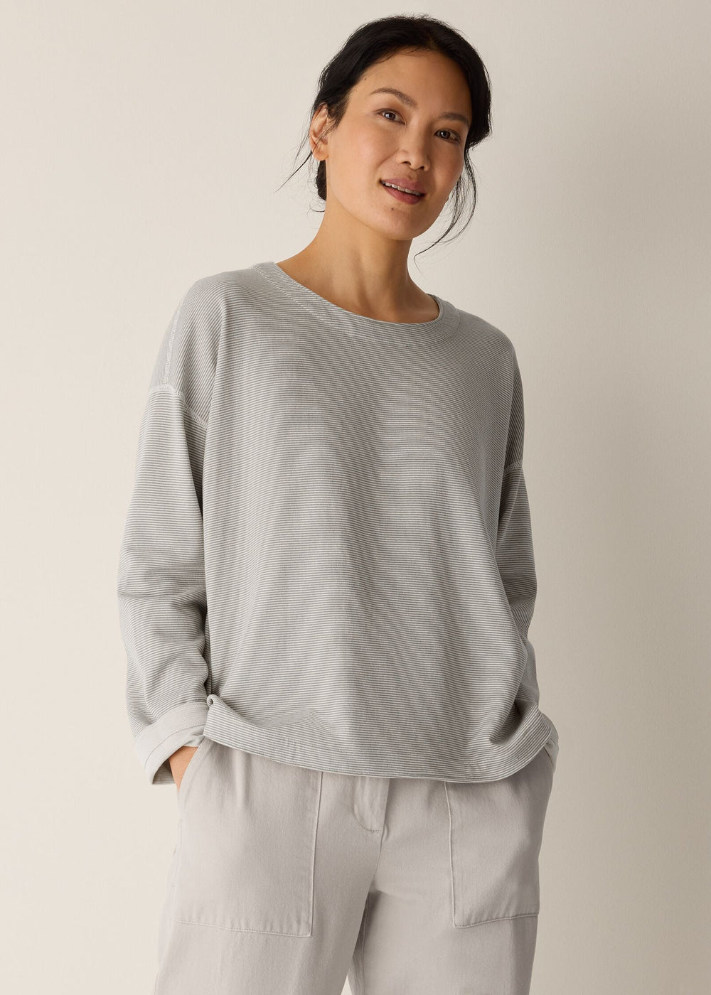 front view of plus size Eileen Fisher Double Knit Organic Round Neck Reversible Striped Top in Bayleaf