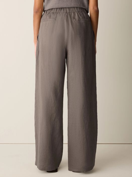 Wide-leg linen trousers in taupe brown, back view showing full length and loose fit