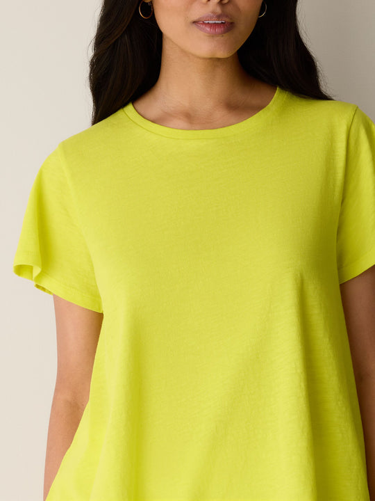 Crew-neck close-up of lemongrass yellow slubby jersey cap-sleeve tee