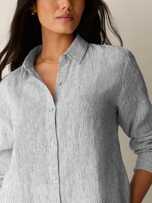 Striped button-up shirt with classic collar worn by model, front view
