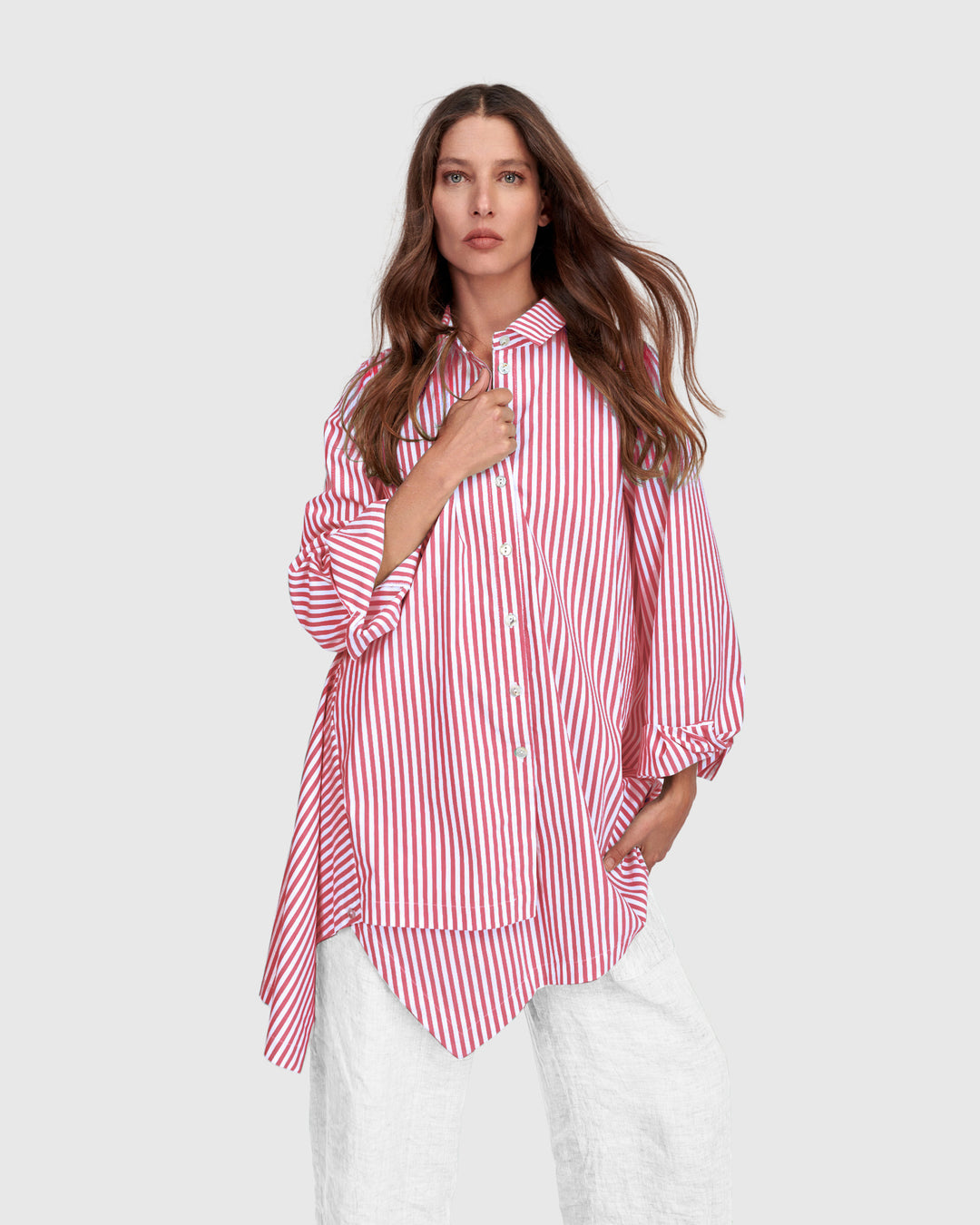Pink striped cotton shirt with point collar, button front, and long gathered sleeves