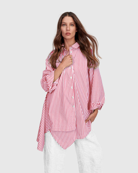 Pink striped cotton shirt with point collar, button front, and long gathered sleeves