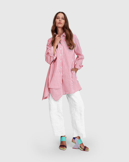 Pink striped cotton shirt with point collar, long sleeves, button front, asymmetrical hem