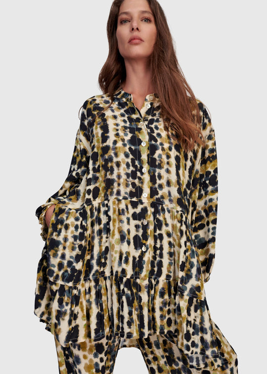 front view of plus size Alembika Trail Animal Print Tiered Button Front Tunic with Ruffle in Trails print