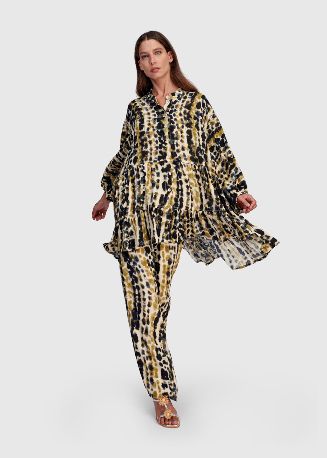 front view of plus size Alembika Trail Animal Print Tiered Button Front Tunic with Ruffle in Trails print
