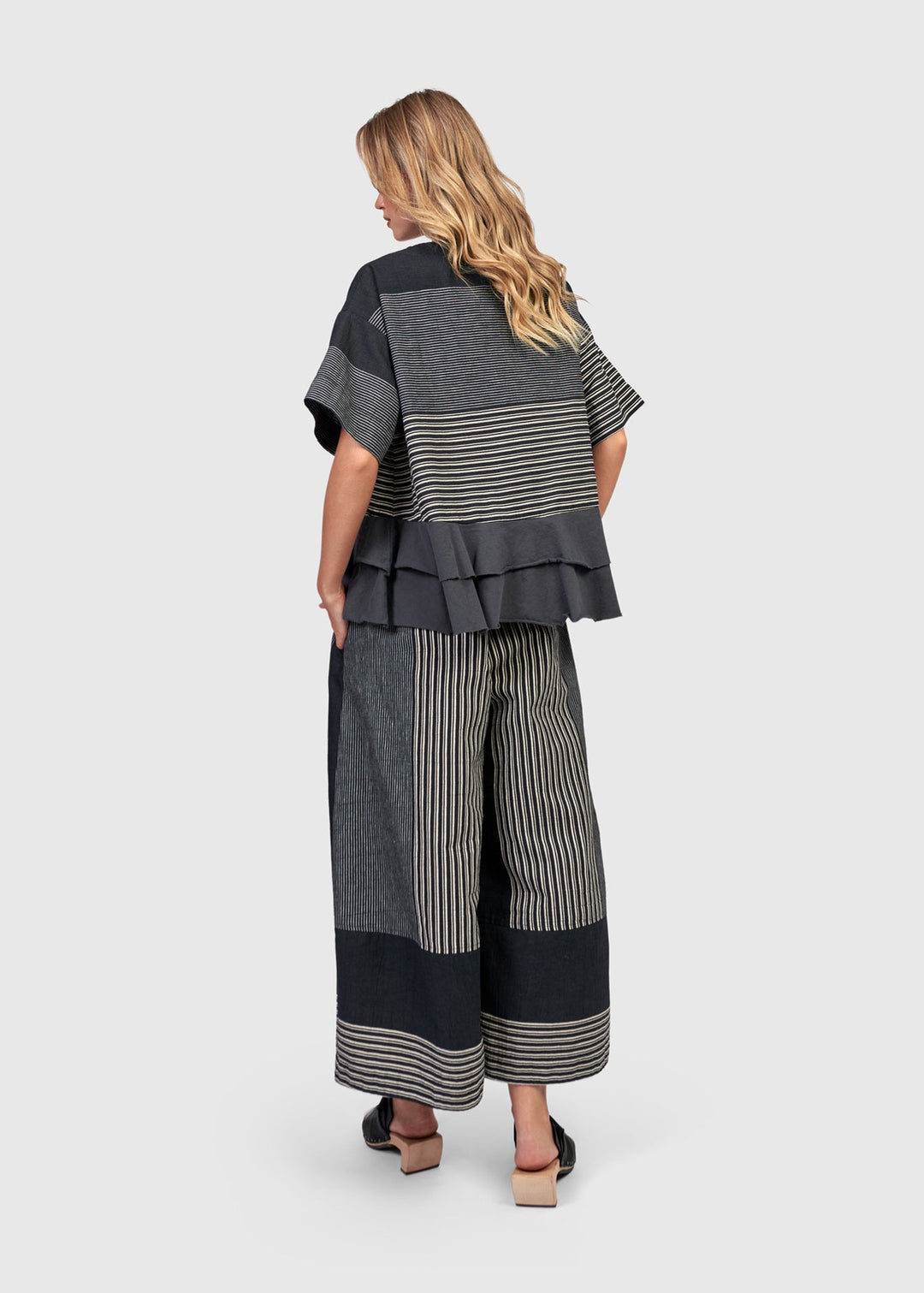 back view of plus size Alembika Mix Stripe Jersey Top with Ruffle Hem