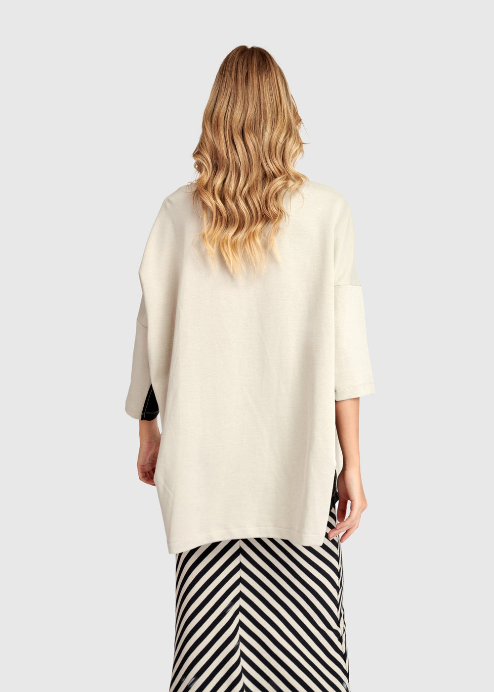 back view of plus size Alembika Scuba Jersey Athleisure Tunic in Mondo