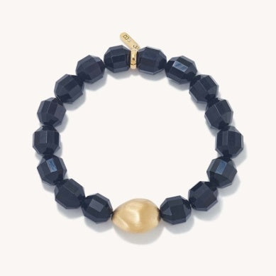 Beaded bracelet with dark faceted cube beads and gold center charm
