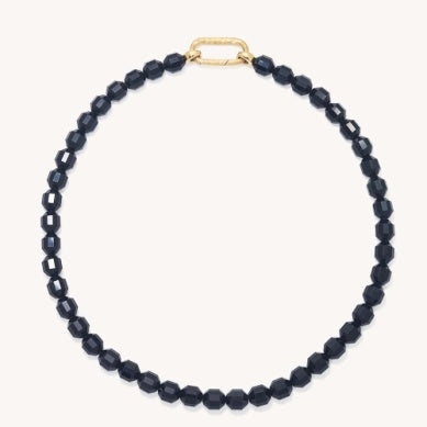 Beaded necklace with dark faceted black beads and small gold clasp loop