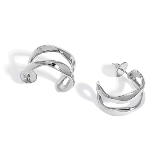 Silver hoop earrings with twisted metal design displayed on white background