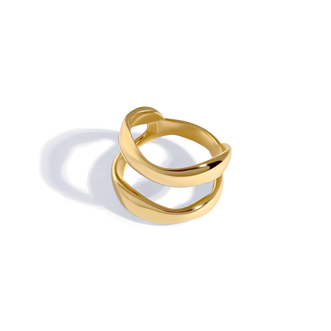 Gold curved open ring with double band design photographed at an angle