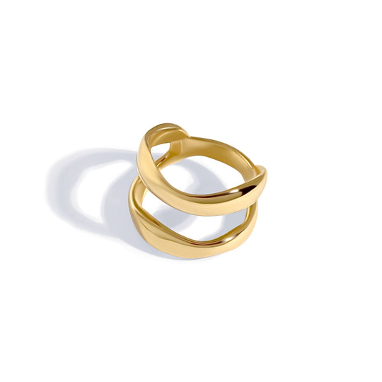 Gold curved open ring with double band design photographed at an angle