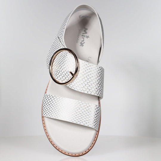 White leather sandal with gold snake embossed pattern and circular buckle detail