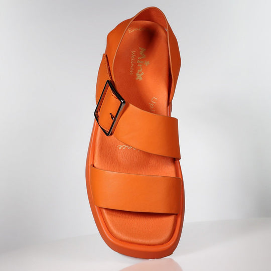 Orange leather sandal with velcro strap and contoured footbed, side view