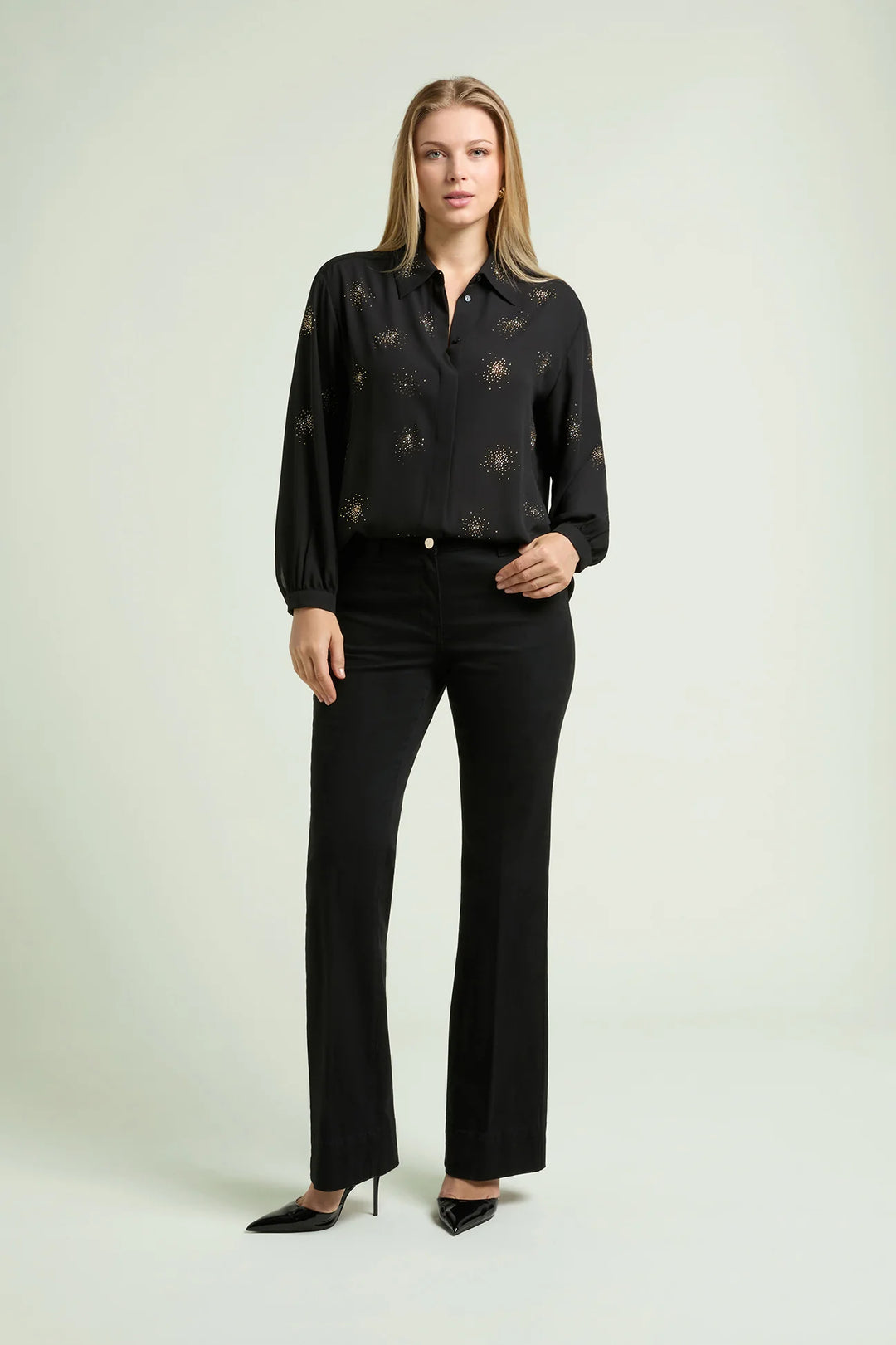 Black long-sleeve blouse with starburst beaded pattern, button-front and cuffs