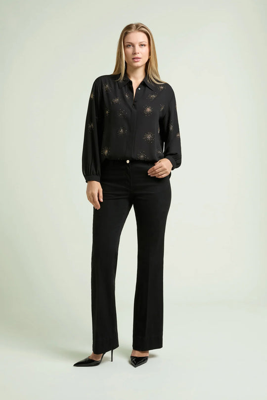 Black long-sleeve blouse with starburst beaded pattern, button-front and cuffs