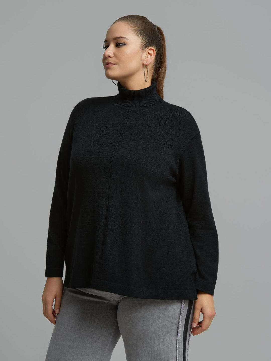 Black turtleneck sweater with ribbed neck and front seam, relaxed fit
