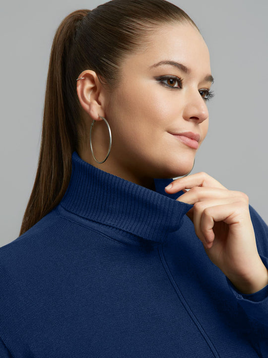 Indigo ribbed turtleneck neckline with front seam detail