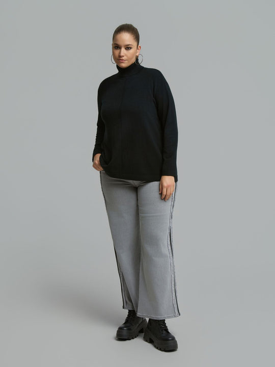 Black turtleneck sweater with ribbed neck and front seam, loose long sleeves
