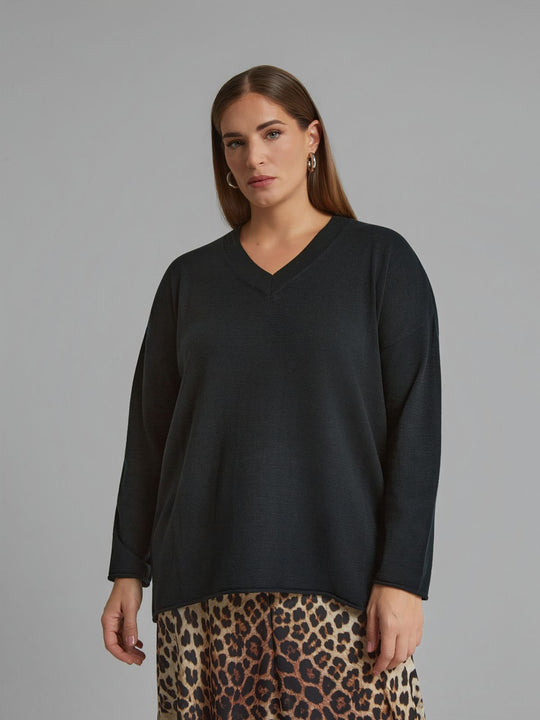 Black V-neck sweater with rolled hem and long sleeves, front view