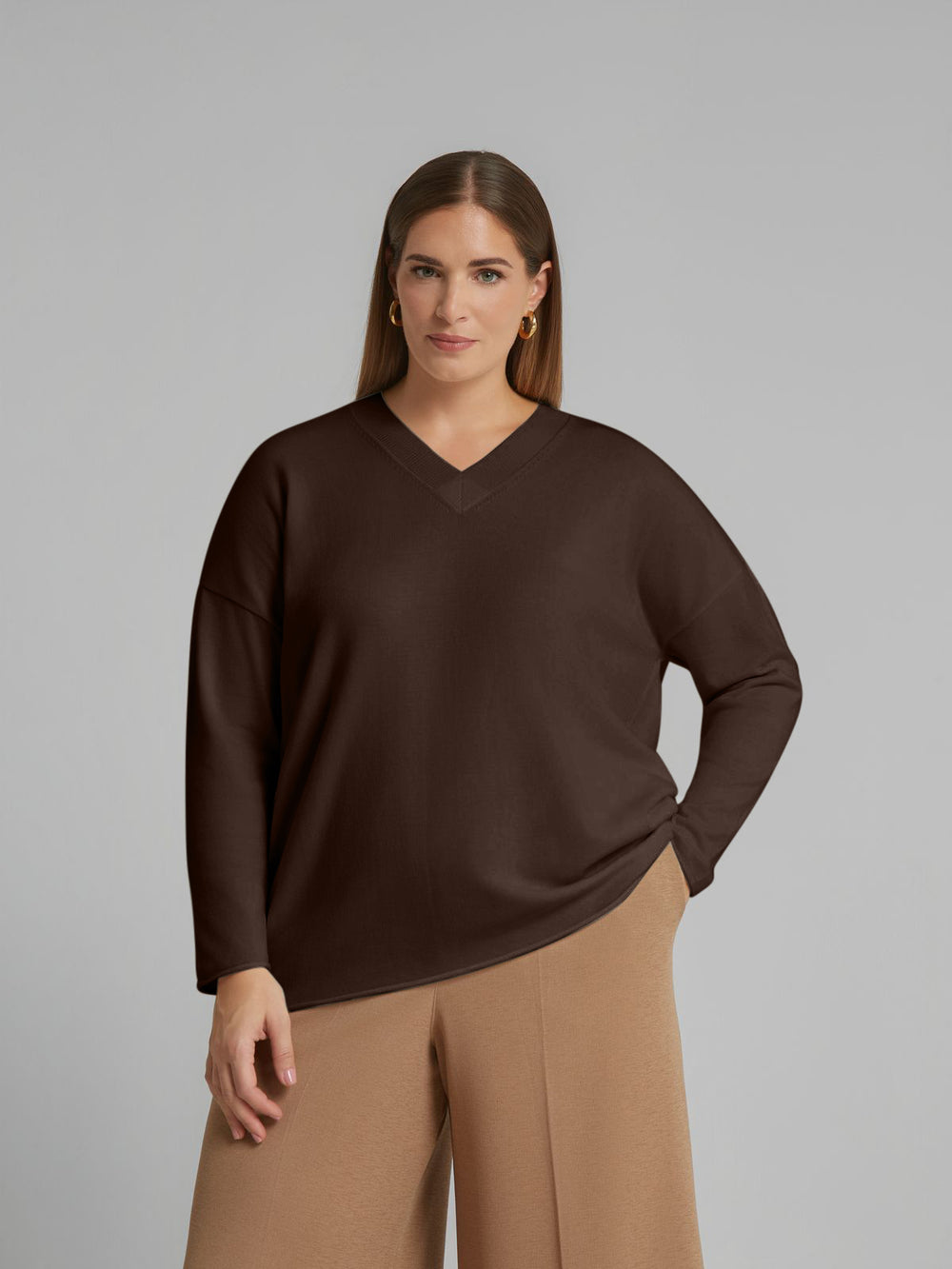 Brown V-neck sweater with long sleeves and roll hem, relaxed fit
