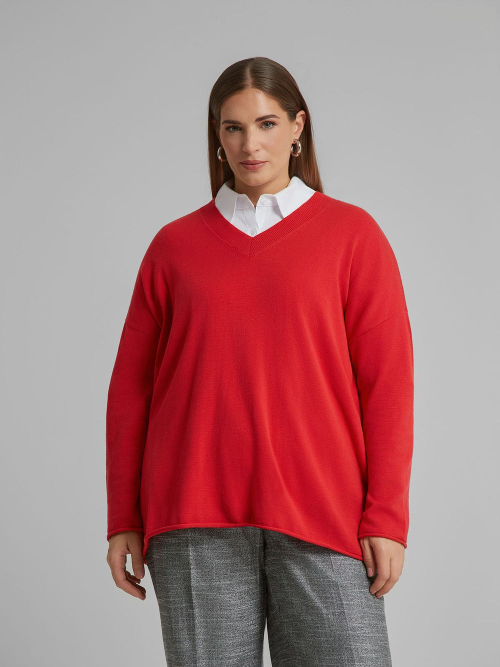 Red V-neck sweater with long sleeves and relaxed fit