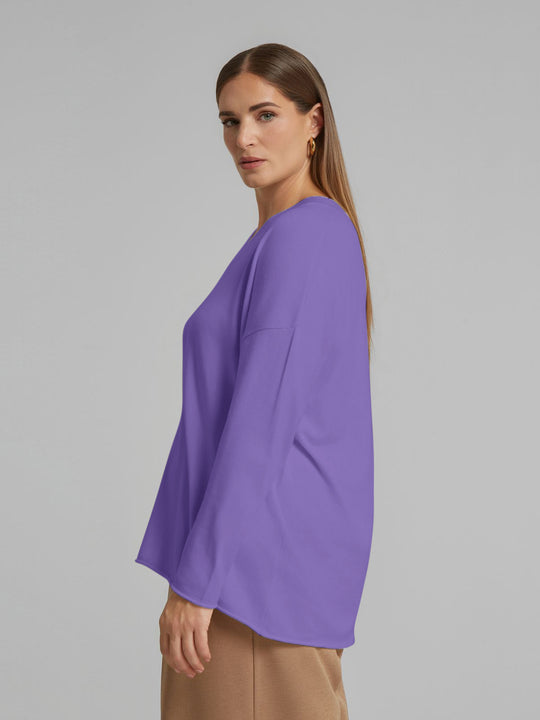 Lilac V-neck sweater, side view with long sleeves and soft drape.