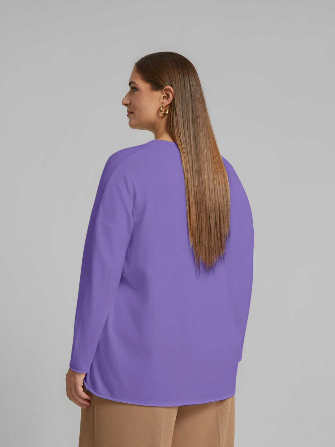Lilac V-neck sweater back view with long sleeves and loose drape.