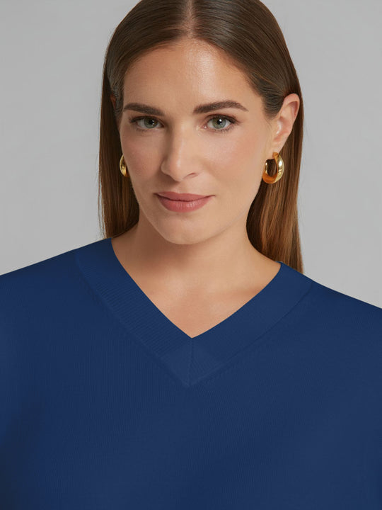 Indigo V-neck sweater neckline detail with smooth knit and rolled hem edge