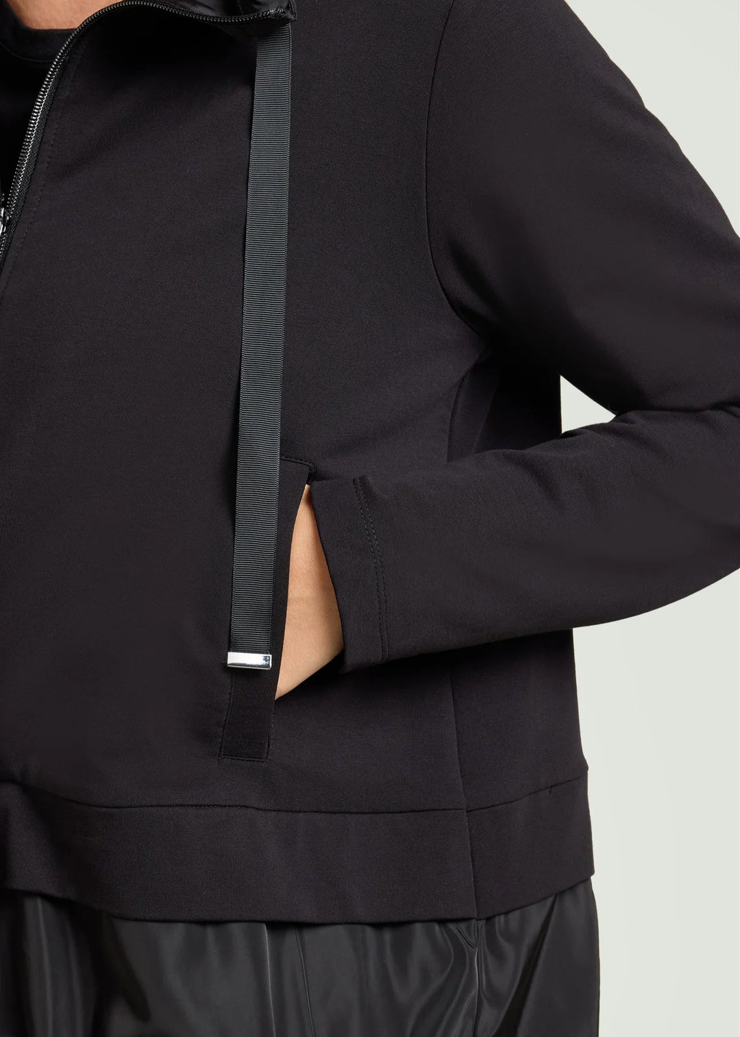 close up front view of plus size Luisa Viola Zip Front Athleisure jacket with taffeta trim in Black