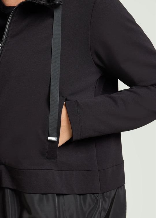 close up front view of plus size Luisa Viola Zip Front Athleisure jacket with taffeta trim in Black