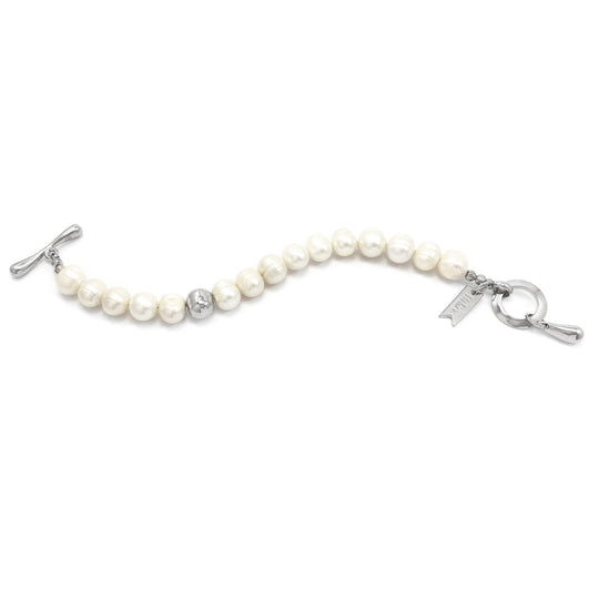 Silver pearl bracelet with bead strand, toggle clasp, and dangling bar charm