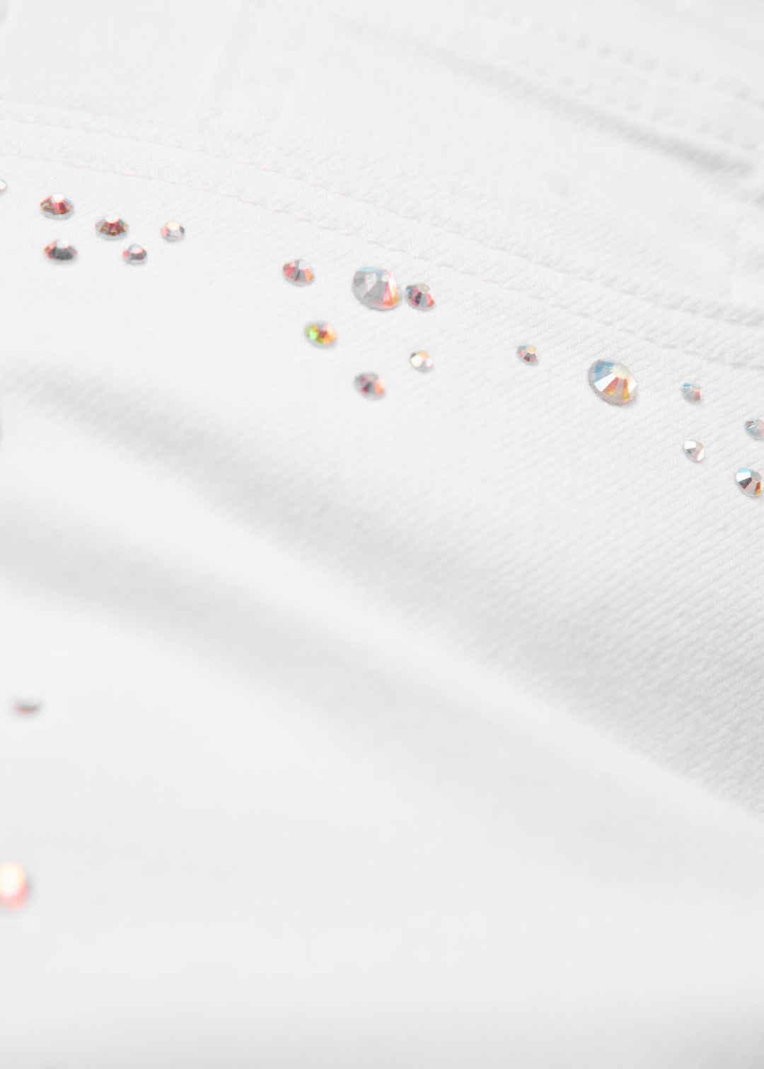 close up front view of plus size Samoon Stretch Slim Leg Betty Jean with embellished sides in White