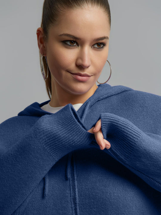 Indigo knit zip hoodie with hood and front zipper, close-up