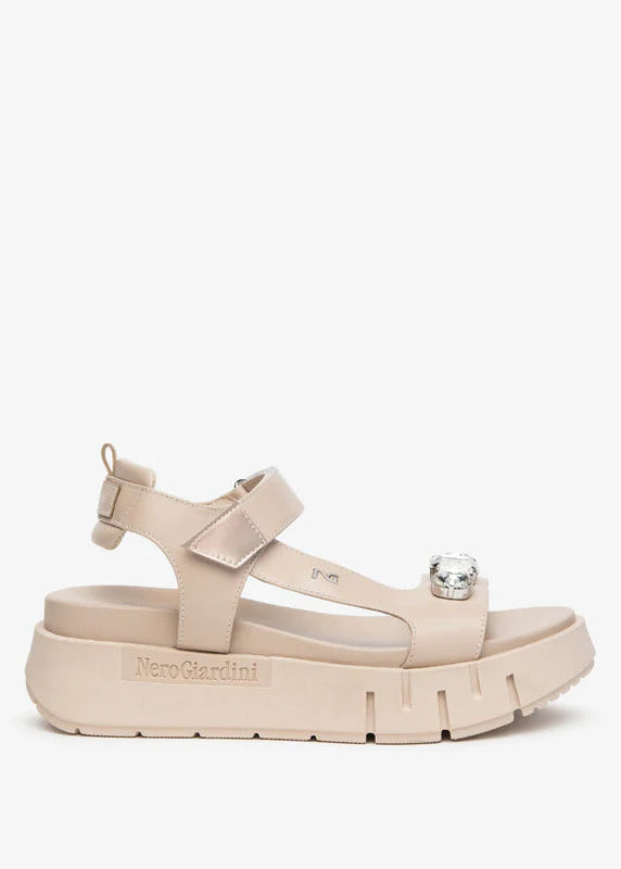 Beige sandal with platform sole on a white background