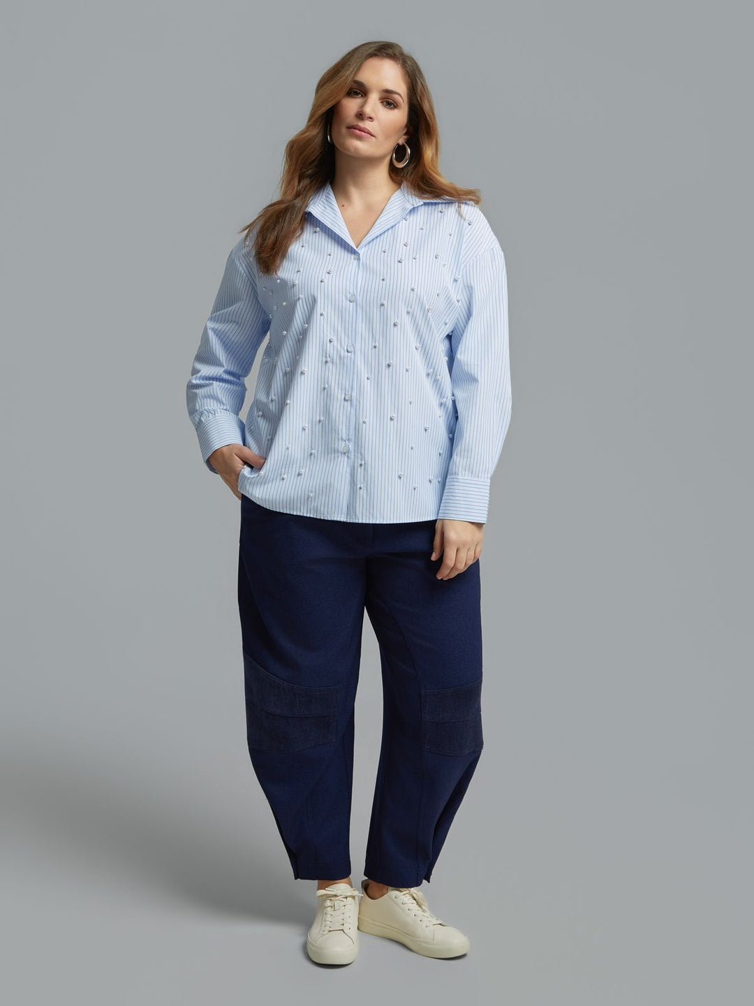 Light blue pinstripe button-front shirt with all-over pearl embellishments, long sleeves, front view on model