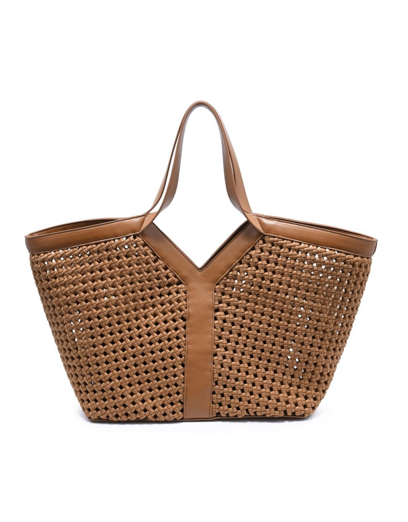 Woven basket tote bag with leather trim and dual handles on white background
