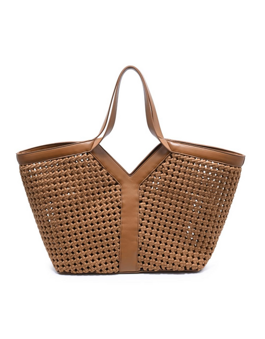 Woven basket tote bag with leather trim and dual handles on white background