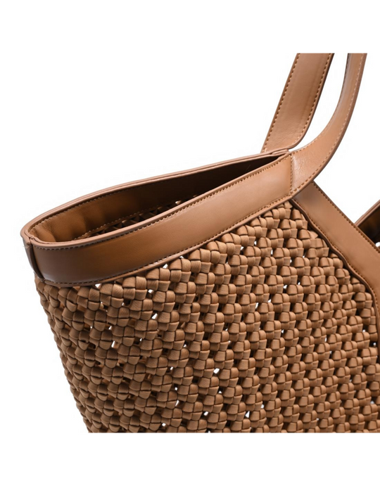 Tan leather woven tote bag with braided pattern and dual handles, close-up view