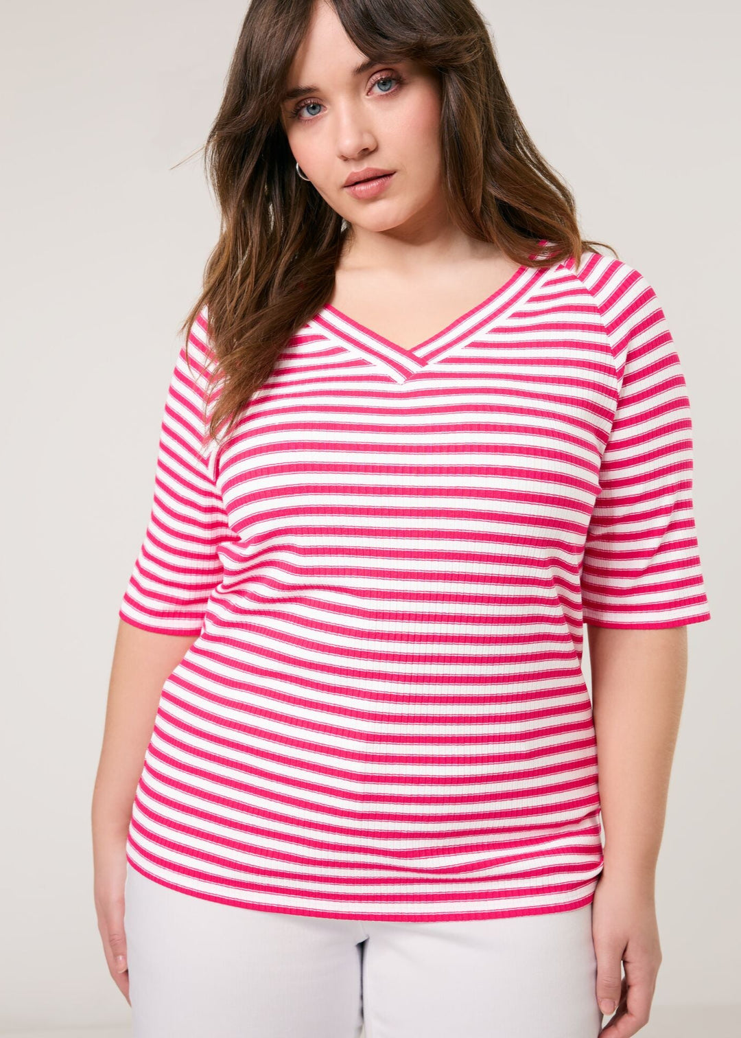 front view on model of plus size Samoon Striped viscose jersey V-neck Elbow Sleeve Tee in Barberry Red