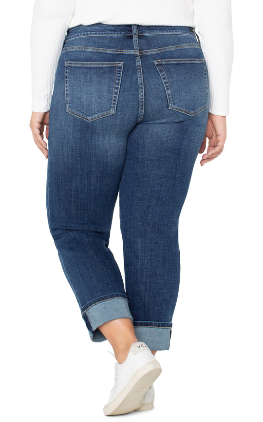 Women's blue denim girlfriend jeans, back view with two rear pockets and cuffed hem