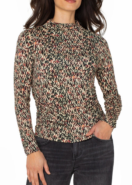 front view of plus size Liverpool Long Sleeve Pleated Mock Neck Knit Top in Multi Geo Ikat