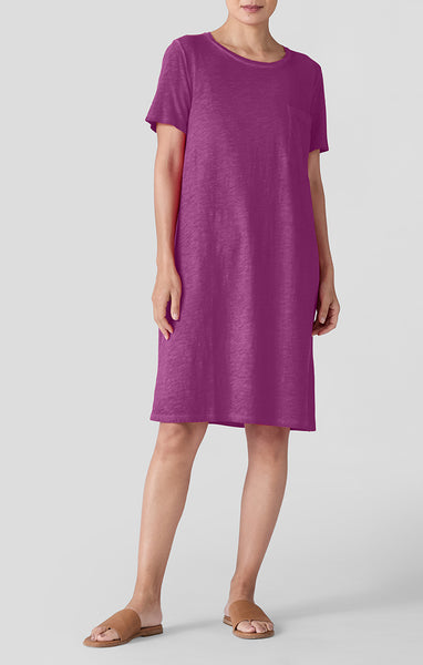 Woman wearing a purple dress on a white background