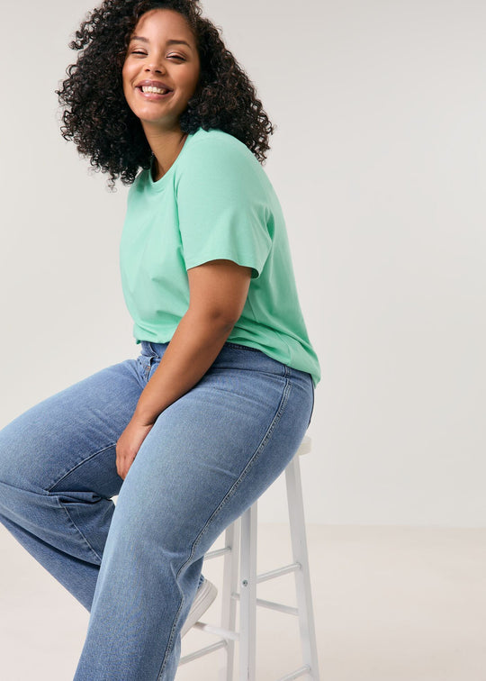 front view of plus size Samoon Carlotta Wide Leg Trouser Jean in Bleached Blue Denim on model